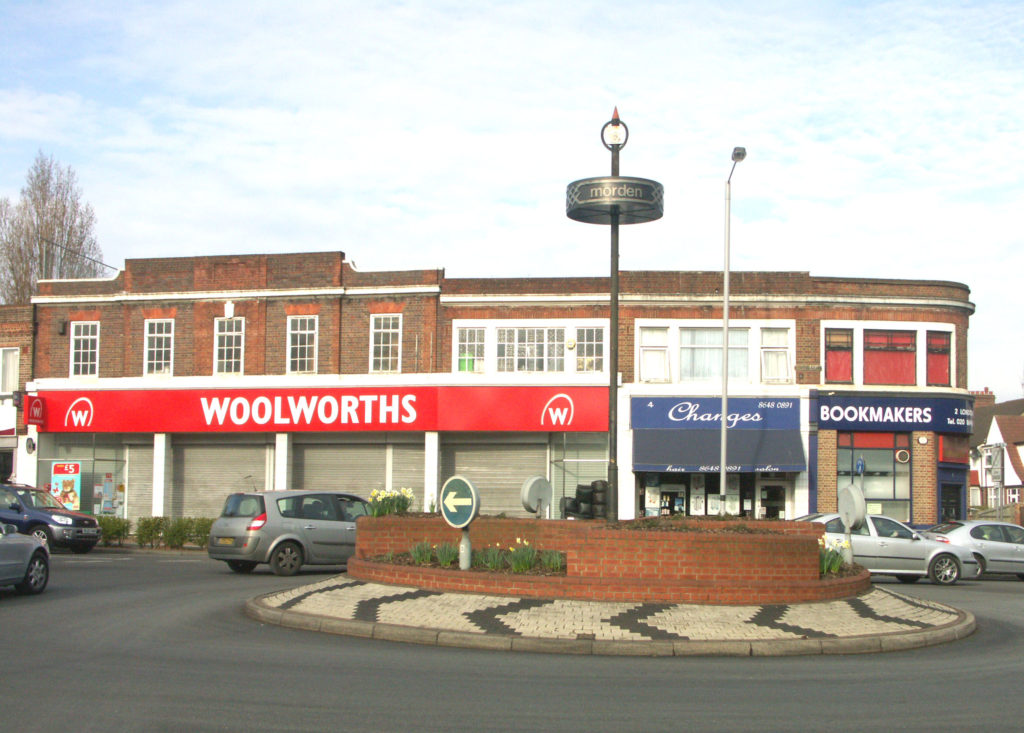 London Road / Morden Road Roundabout, Morden, Surrey SM4. Woolworths with new-style fascia (closed later in year with end of company)