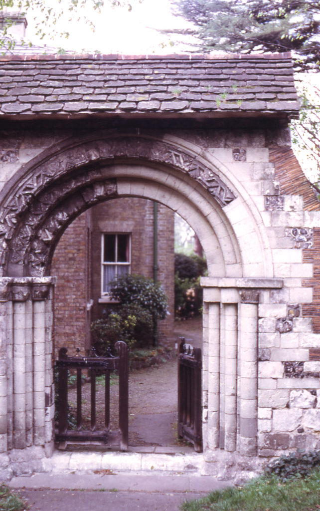 Norman Arch from Merton Priory in churchyard of St Mary