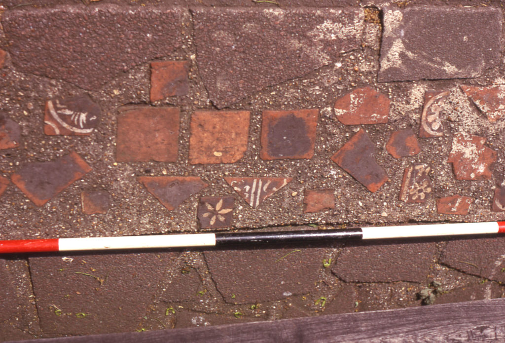 Medieval floor tiles from Merton Abbey, Moved to Ravensbury Park.