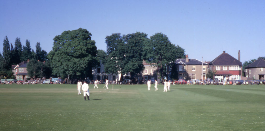 Cricket match on Lower Green, Mitcham, Surrey CR4. From the Clubhouse. looking east.