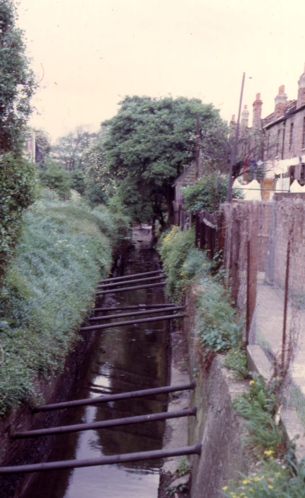 River Graveney, Colliers High Street, Colliers Wood, London SW19. Looking south. High Street on left ?.