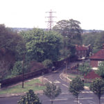 Grounds of Wandle Villa and Phipps Bridge Road from Council flats, Mitcham, Surrey CR4.